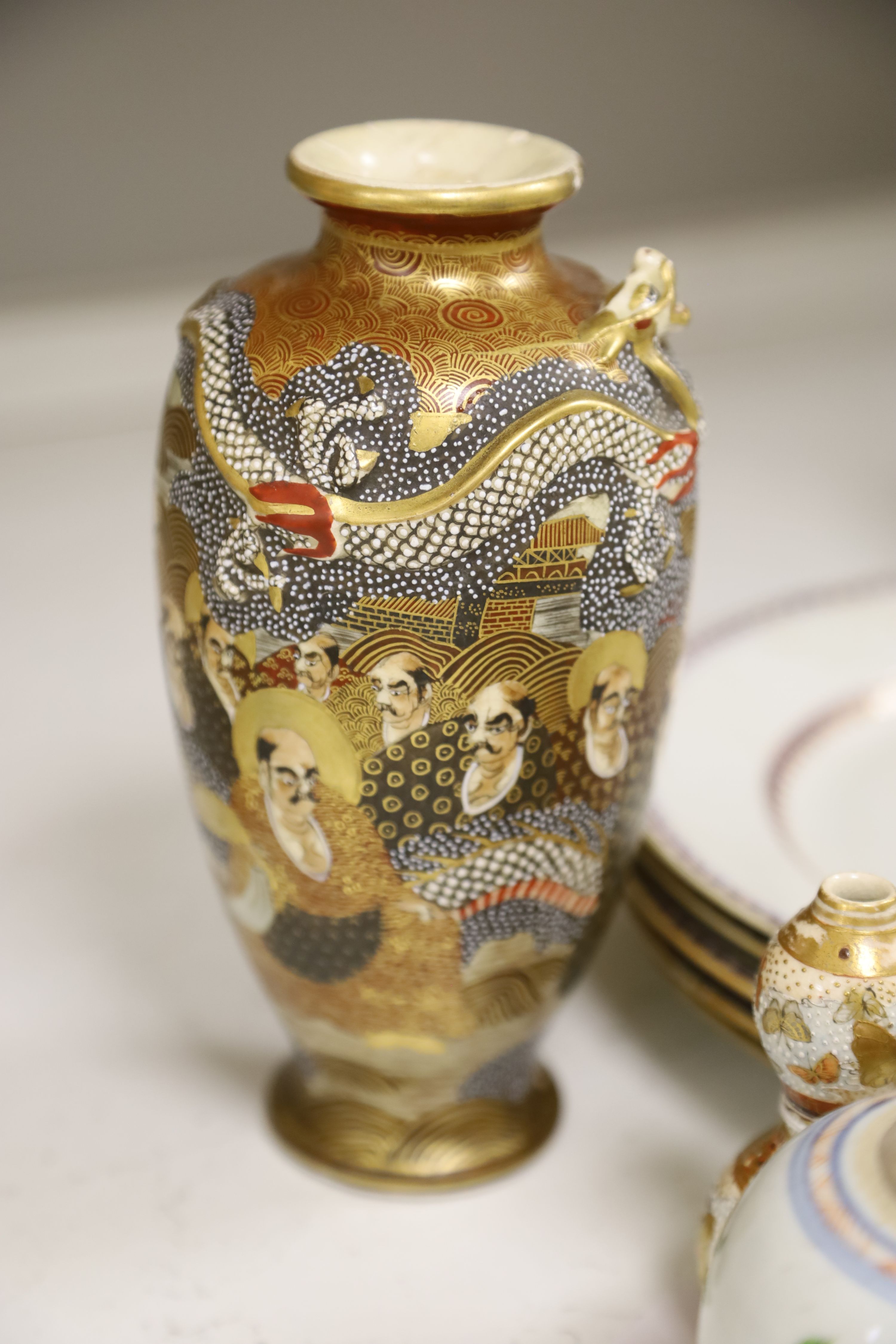 A collection of mixed Asian ceramics, including various Chinese blue and white export plates,